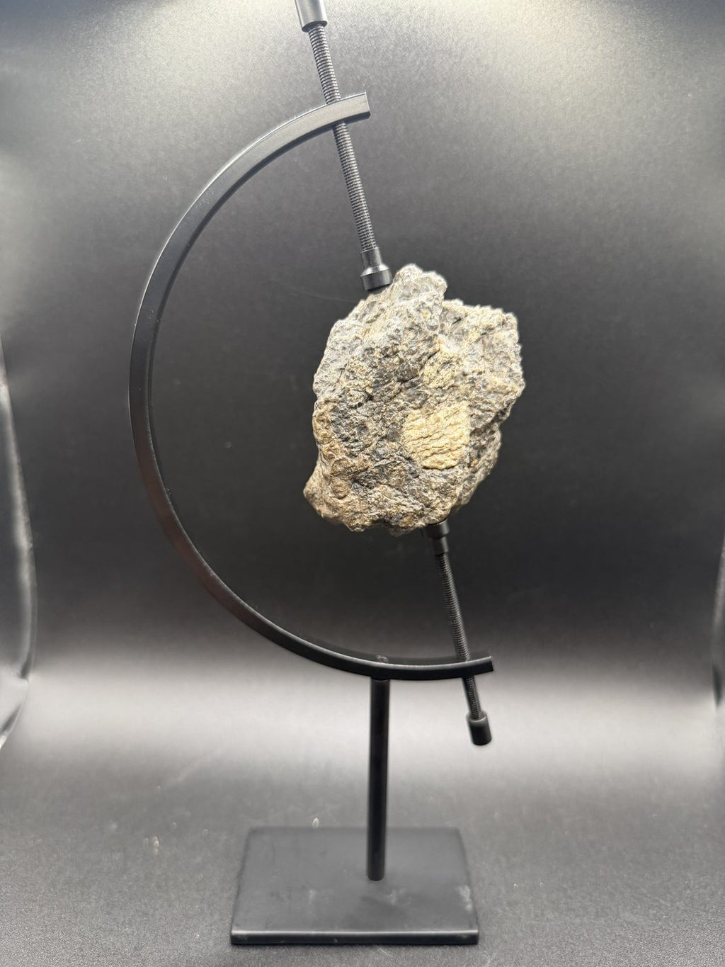Full display view of the 193.73g Laâyoune 002 lunar feldspathic breccia on its stand