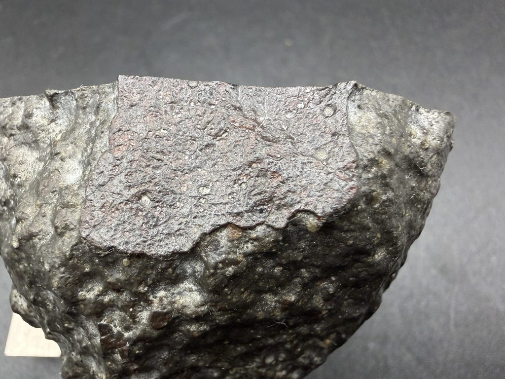 Well-preserved primary fusion crust on the Sinawan 005 main mass, with secondary crust alongside