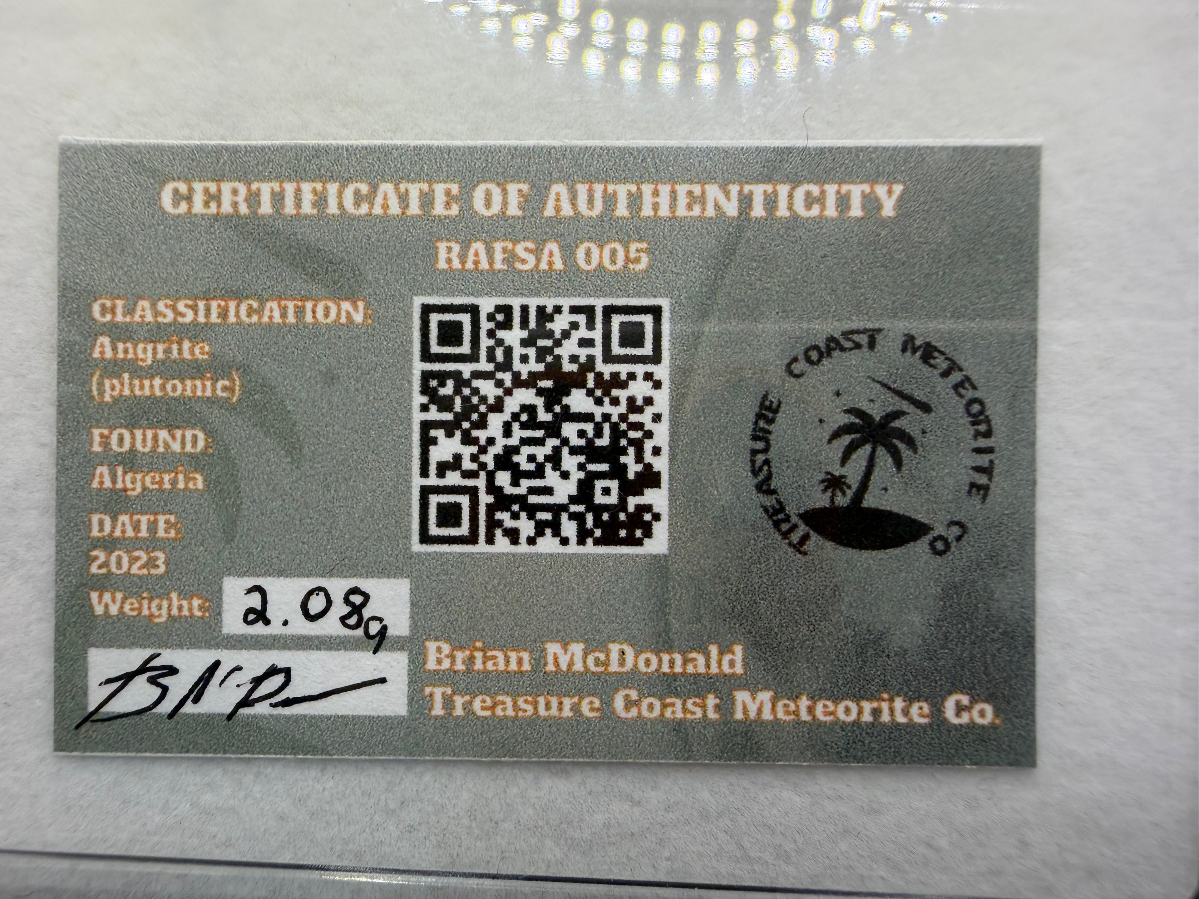 Certificate of Authenticity for a meteorite with a QR code and branding details.
