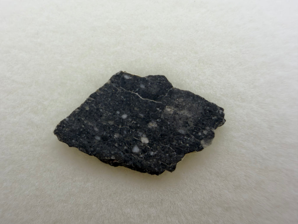 Rabt Sbayta 007 lunar meteorite 0.83g -- angular plagioclase clasts in impact-welded breccia matrix
