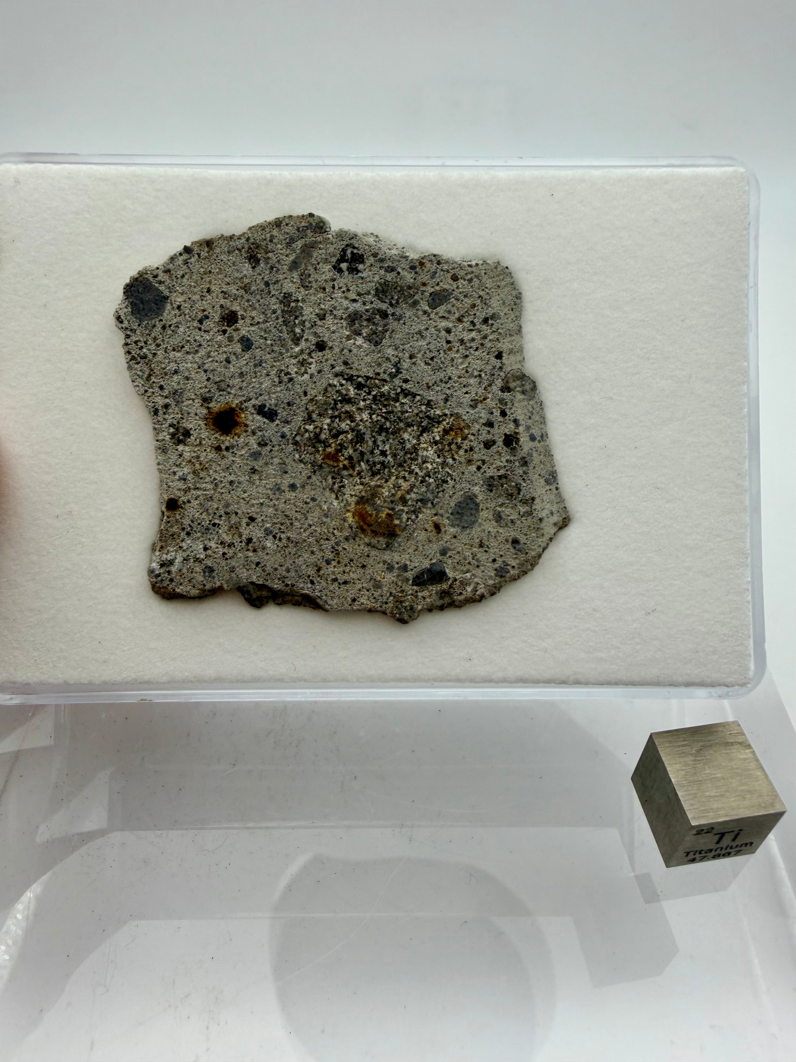 NWA 17708 howardite 12.00g -- sanded face showing eucritic and diogenitic clasts in impact-mixed matrix