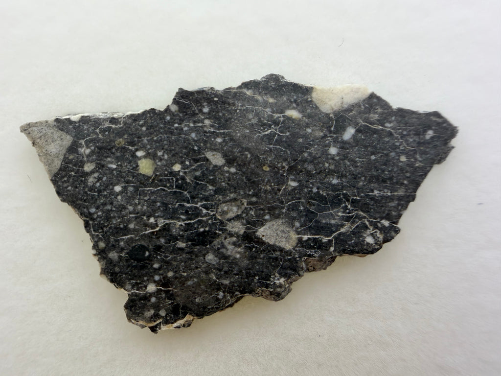 Rabt Sbayta 007 lunar meteorite 2.60g -- angular feldspathic clasts visible in fine-grained impact matrix