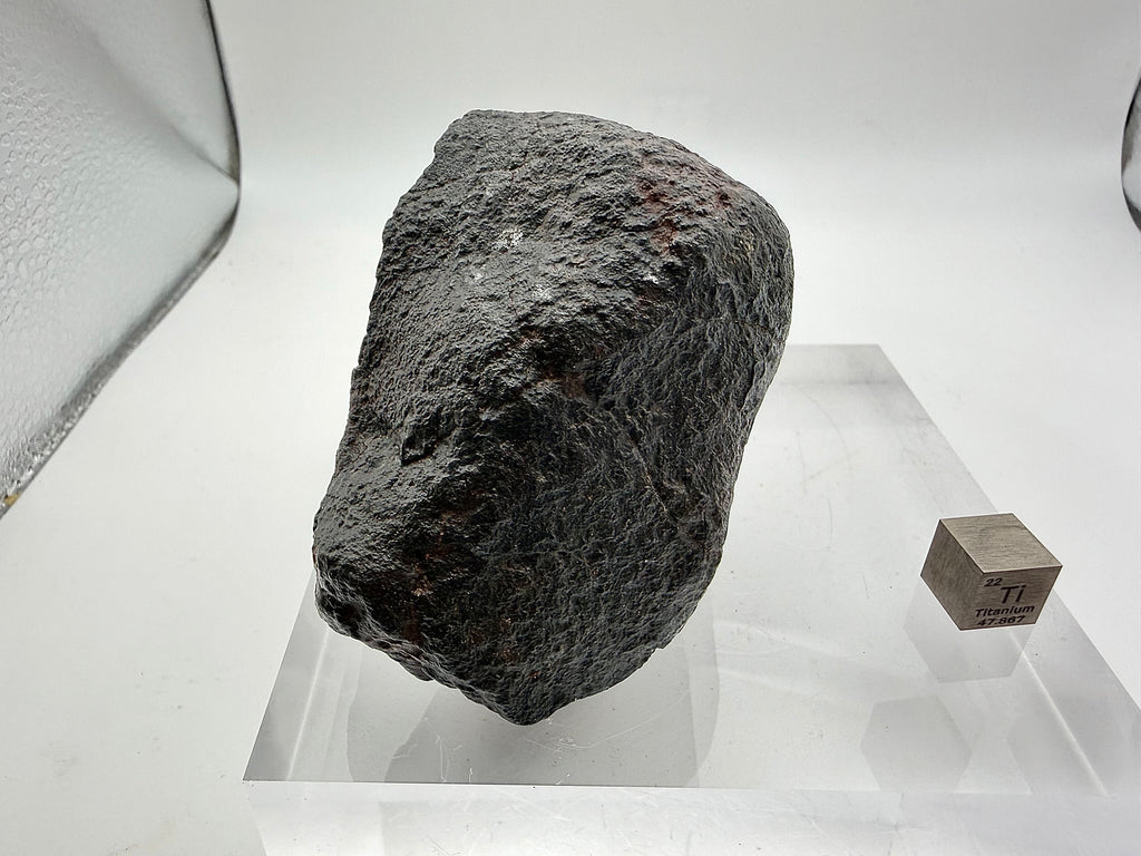 NWA XXX ordinary chondrite 316.40g -- oriented leading edge showing thickened fusion crust from atmospheric compression heati