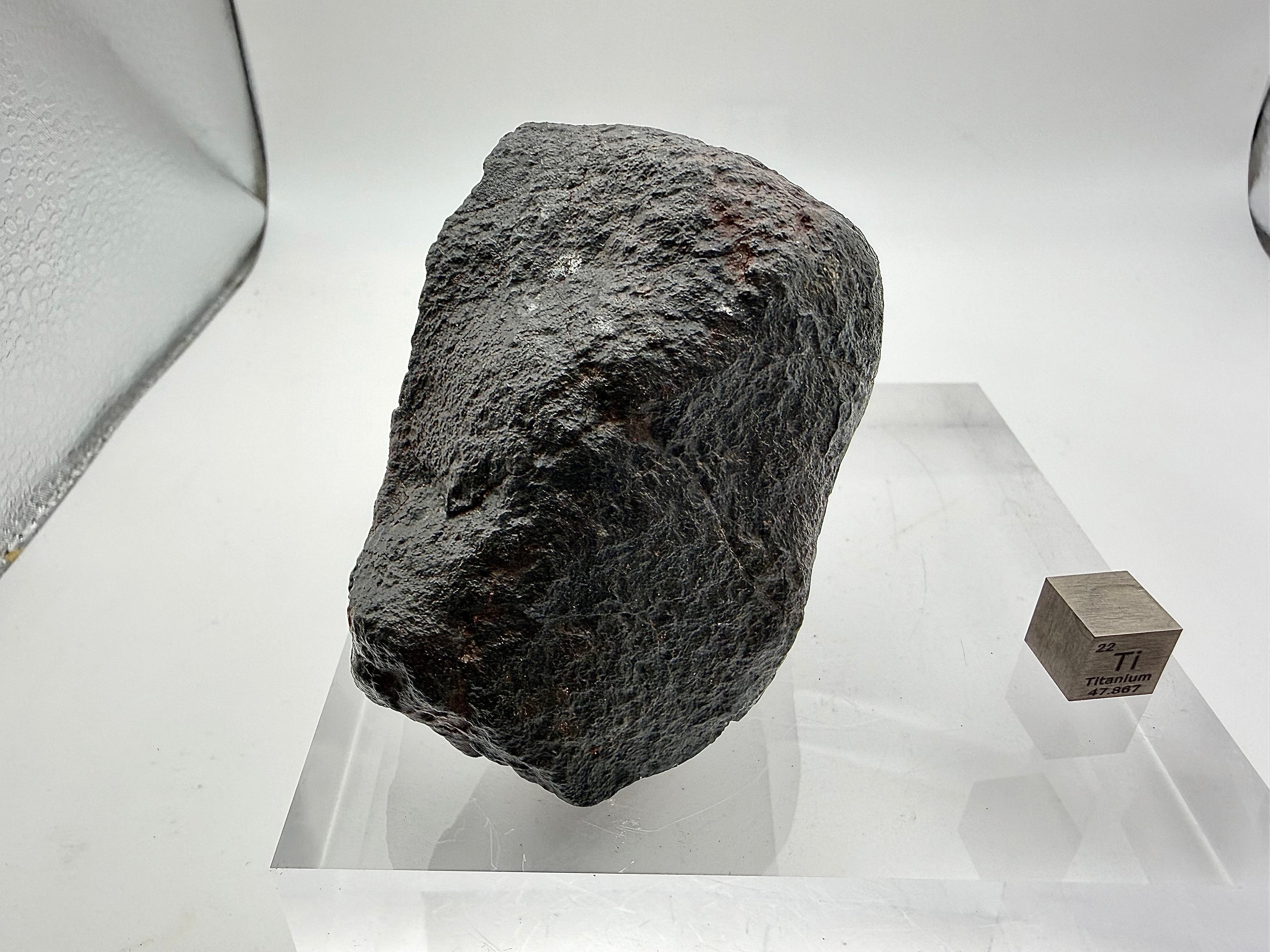 NWA XXX ordinary chondrite 316.40g -- oriented leading edge showing thickened fusion crust from atmospheric compression heati