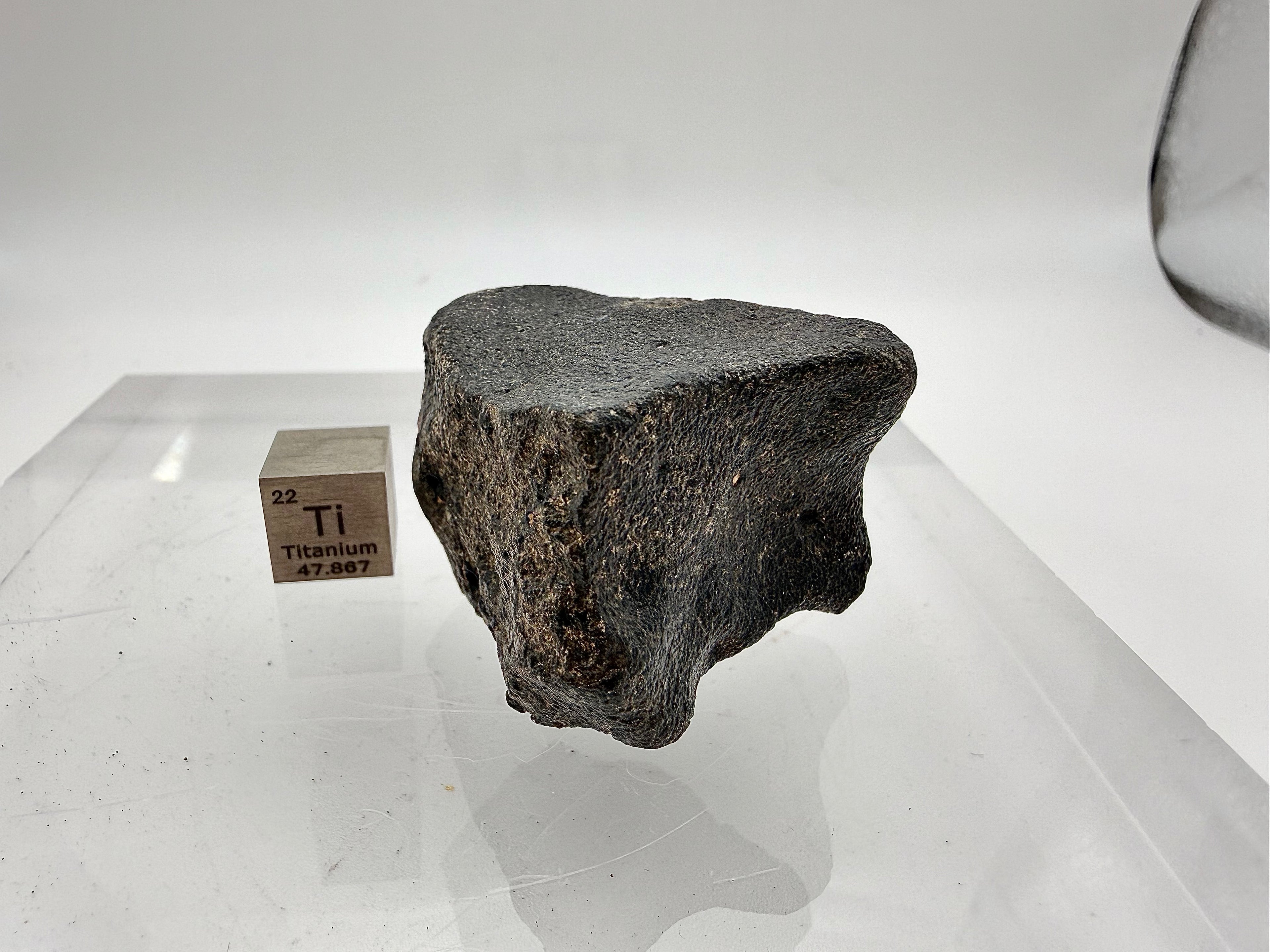 Guemar 002 unbrecciated mare basalt 45.92g -- primary igneous texture visible in cross-sectional exposure