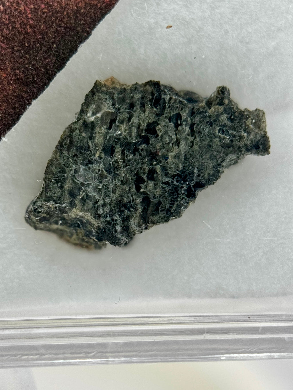 NWA 17472 shergottite fragment 0.10g -- dark gray basaltic texture with pyroxene crystals from Martian volcanic flow