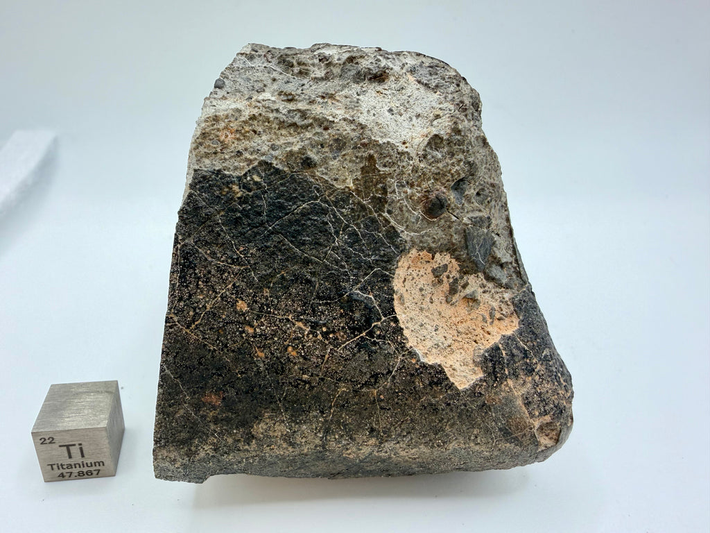 NWA 17708 howardite end cut 350.42g -- fresh rippled fusion crust covering approximately 50% of exterior surface
