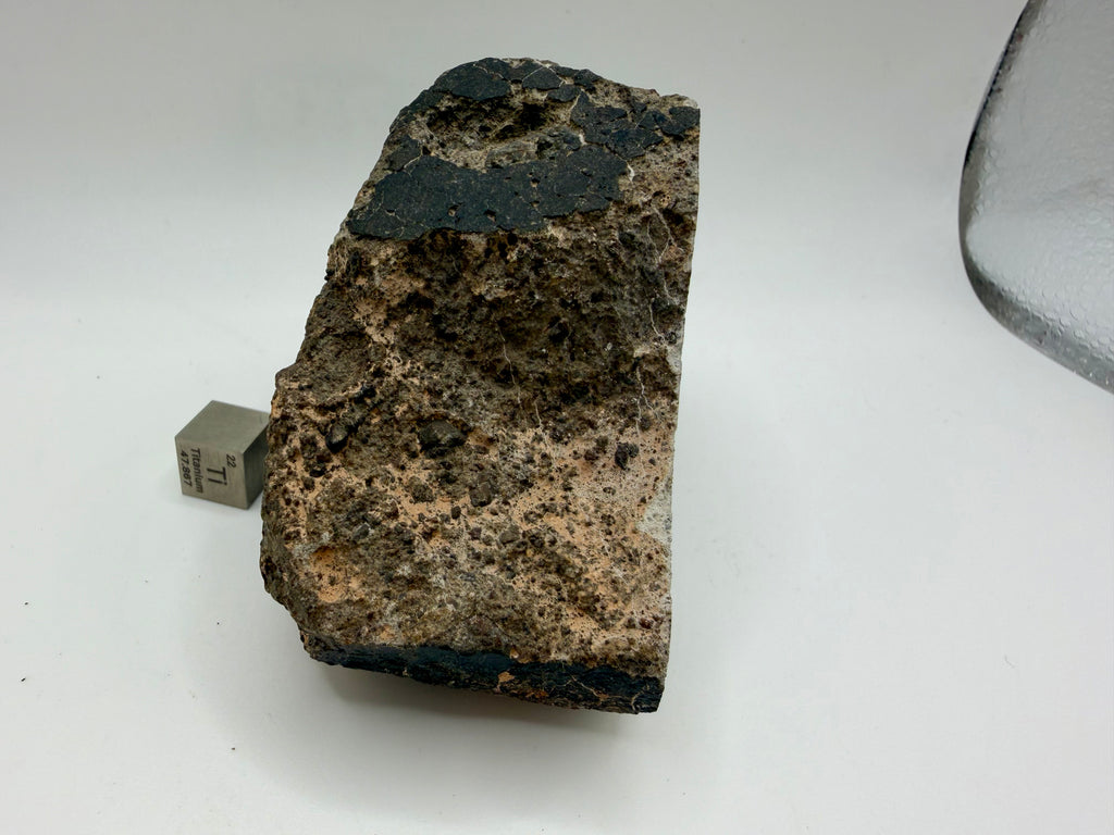 NWA 17708 howardite meteorite 350.42g -- brecciated interior showing eucritic and diogenitic clasts in fine-grained matrix