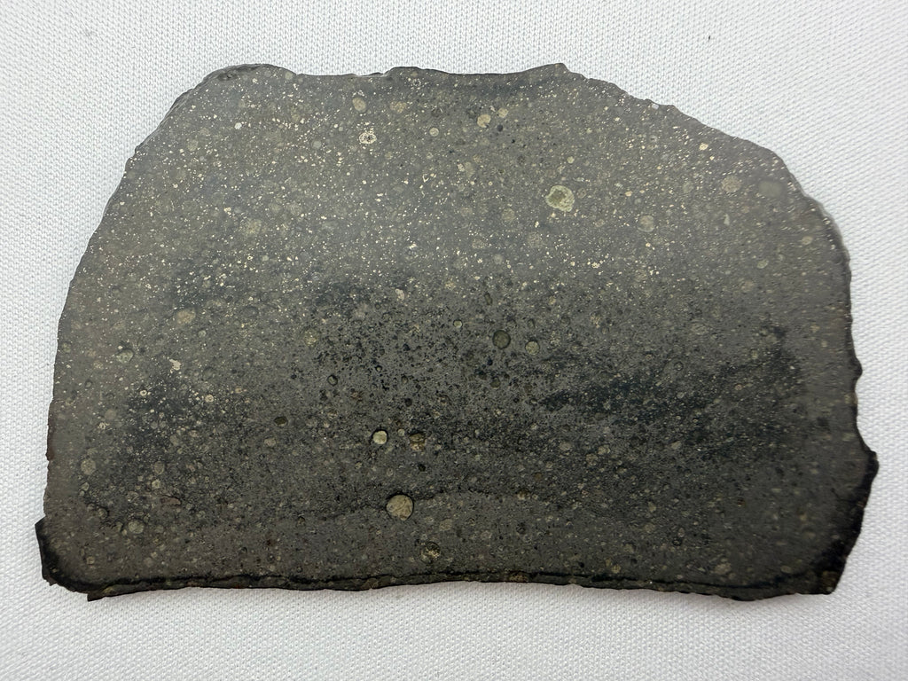 Sinawan 005 Rumuruti chondrite 22.16g -- light and dark lithological boundary with fusion crust edge