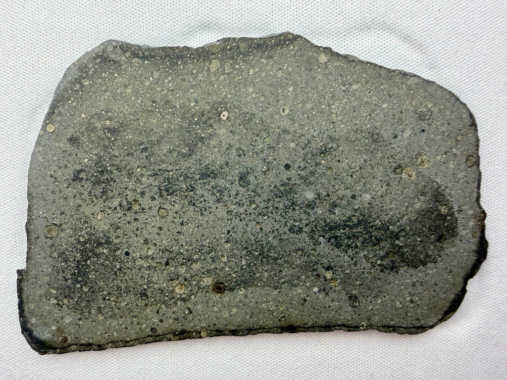Sinawan 005 R-chondrite 23.89g -- fusion crust edge and oxidized olivine grain texture under magnification