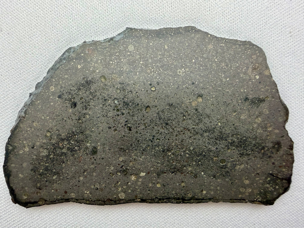 Sinawan 005 rumuruti chondrite 20.29g -- light and dark lithology boundary with visible chondrules in oxidized matrix