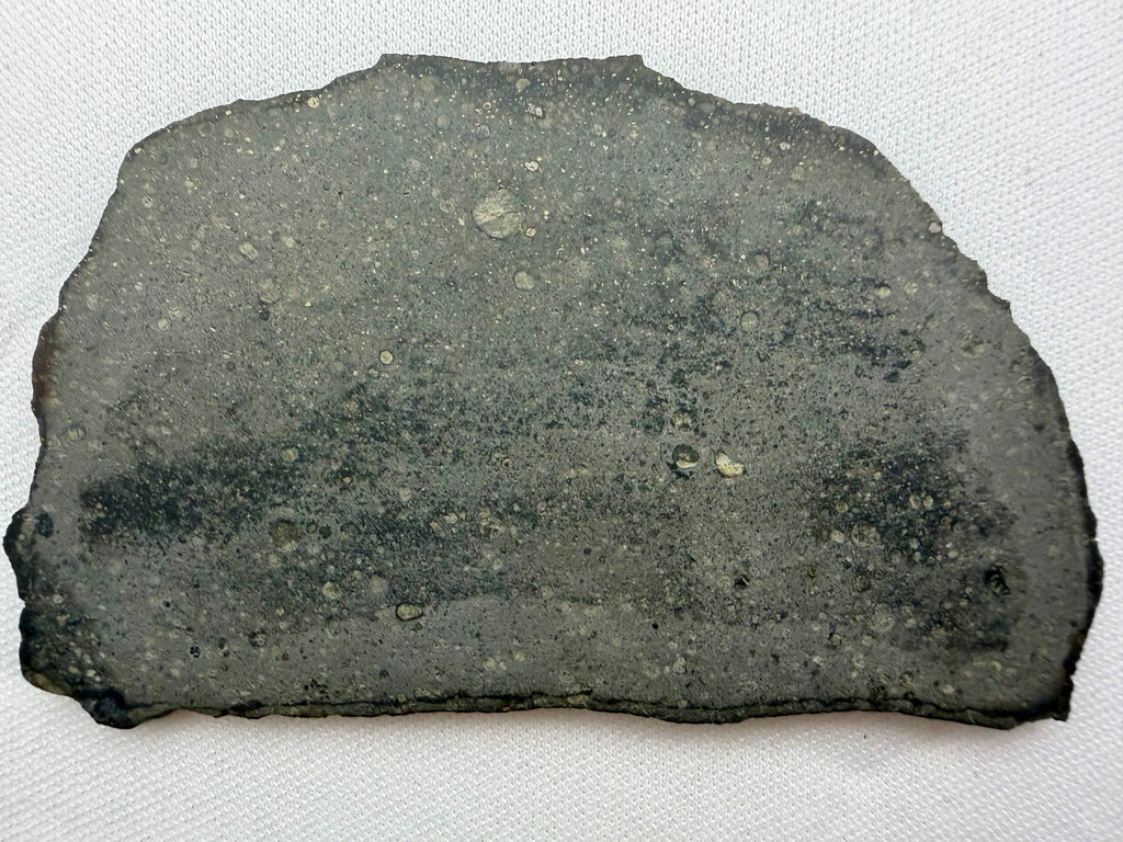 Sinawan 005 R-chondrite 20.29g -- complete slice showing textural contrast between two distinct lithology zones