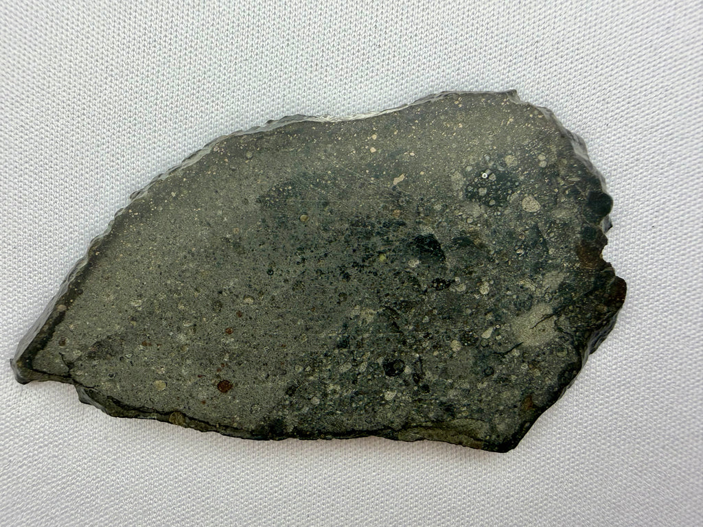 Sinawan 005 rumuruti meteorite 14.49g -- light and dark lithology boundary with partial fusion crust detail