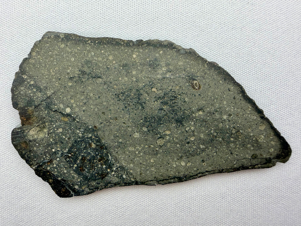 Sinawan 005 rumuruti meteorite 12.51g -- contrasting light and dark lithology boundary with partial fusion crust