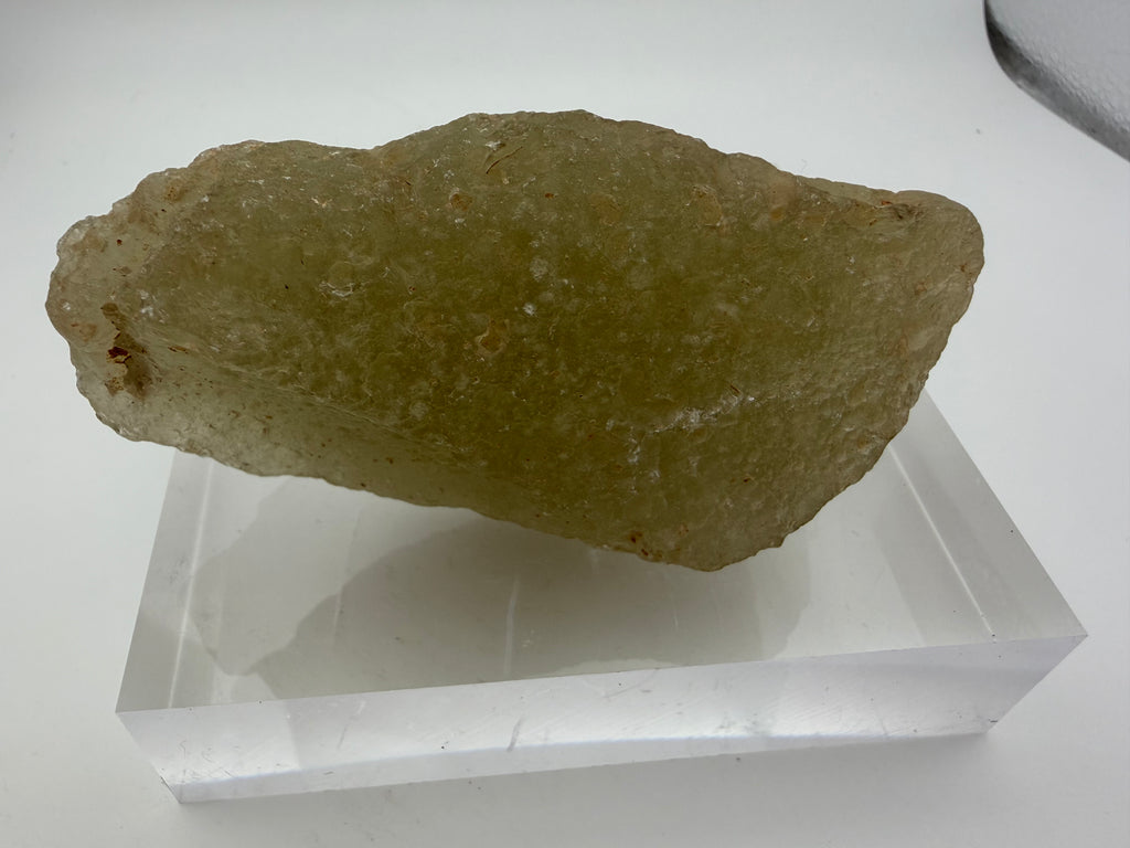 Libyan Desert Glass 178.68g -- side profile displaying translucency gradients and natural edge contours formed during cooling