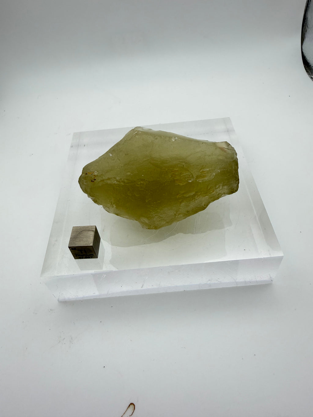 Libyan Desert Glass 93.19g -- translucent golden surface showing natural flow textures and wind-polished areas