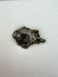 Gebel Kamil iron meteorite 1.00g in acrylic box -- crater-recovered specimen with certificate of authenticity and specimen ca