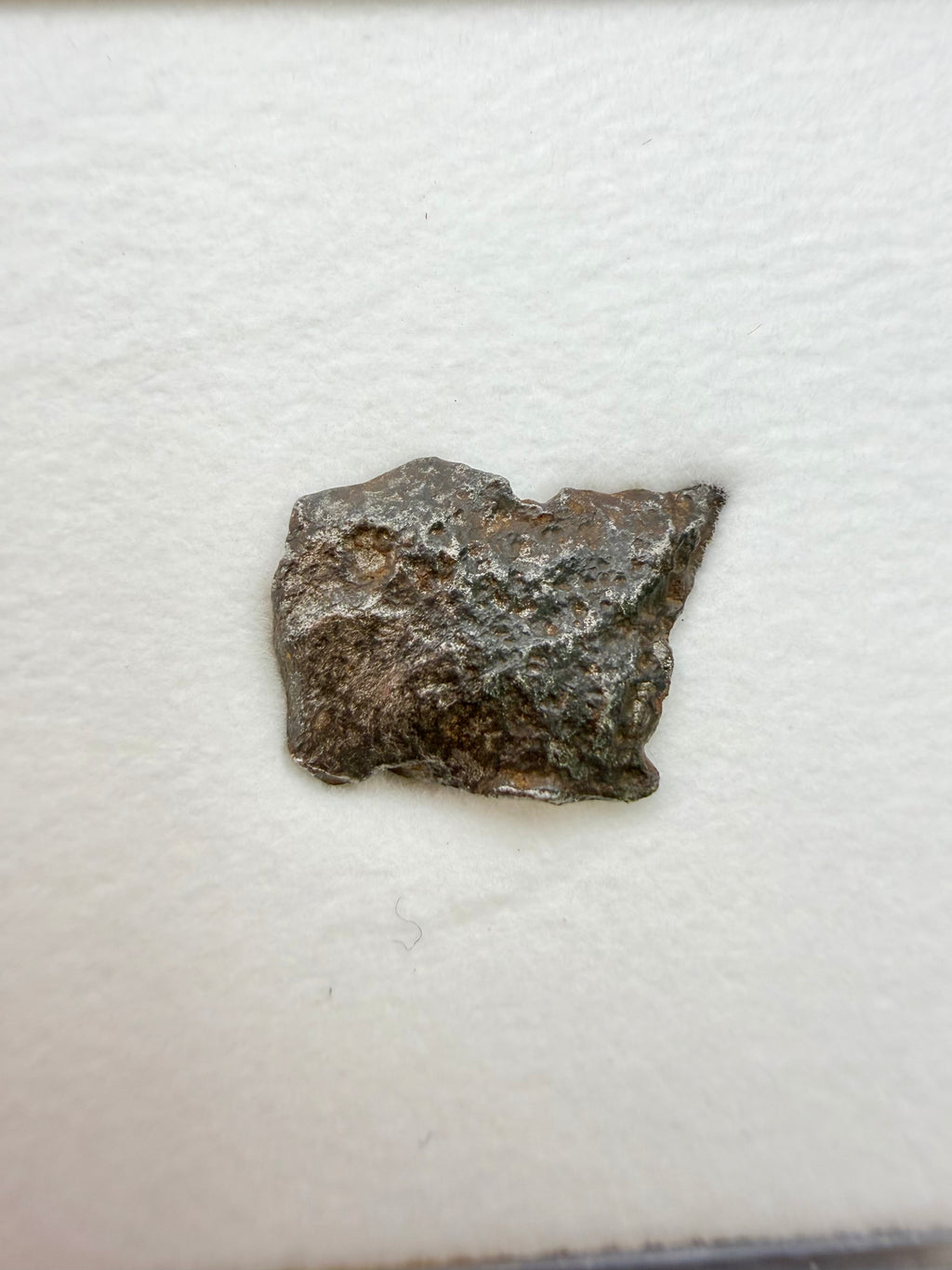 Gebel Kamil iron meteorite individual 1.00g -- compact specimen displaying characteristic ungrouped ataxite composition