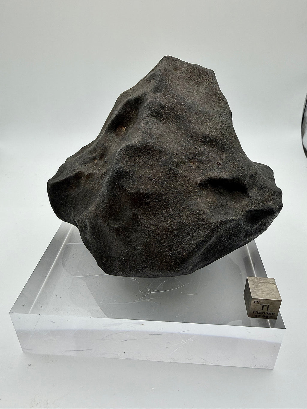 NWA XXX ordinary chondrite 820.15g -- contraction cracks radiating across fusion crust on leading ablation surface