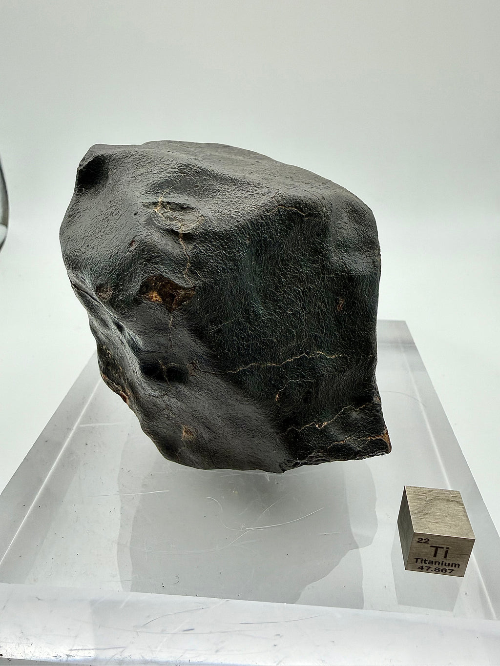 NWA XXX chondrite 635.58g -- oblique view of oriented geometry with smooth leading edge and trailing flow features