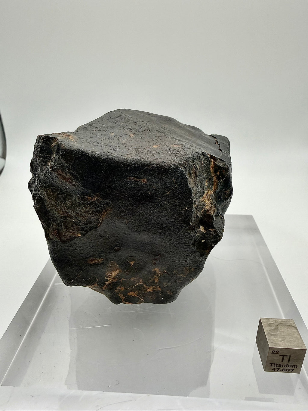 NWA XXX chondrite 635.58g -- contraction crack network exposing interior material beneath black fusion crust