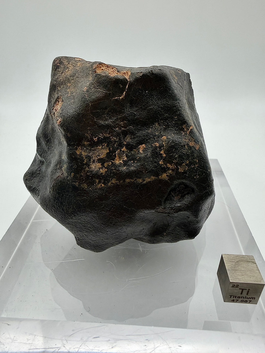 NWA XXX chondrite 635.58g -- lateral view showing crust preservation and flight-oriented profile geometry