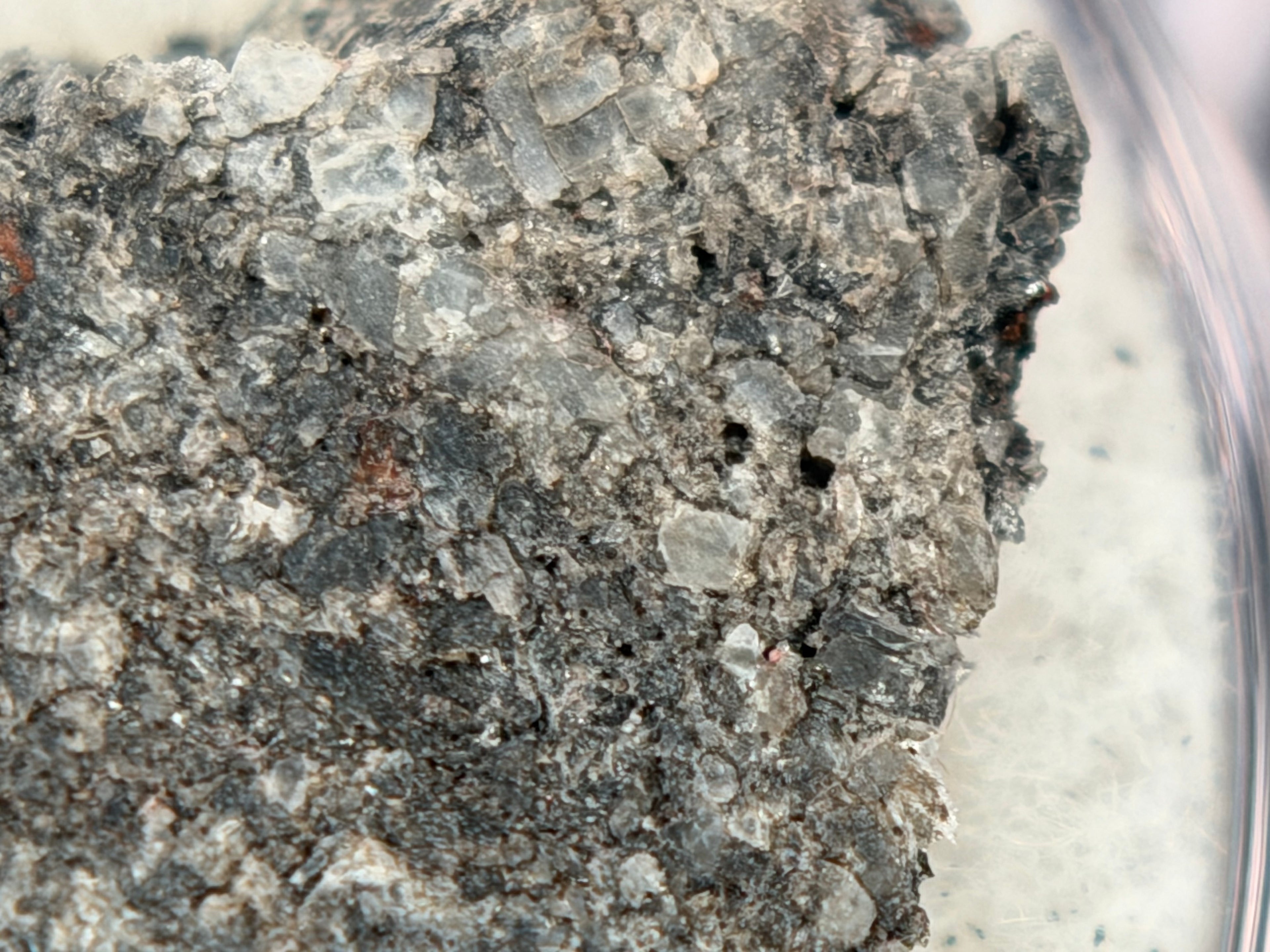 Ksar Ghilane 022 achondrite 2.11g -- coarse pyroxene crystallization texture showing 1.5 mm average grain size in differentia