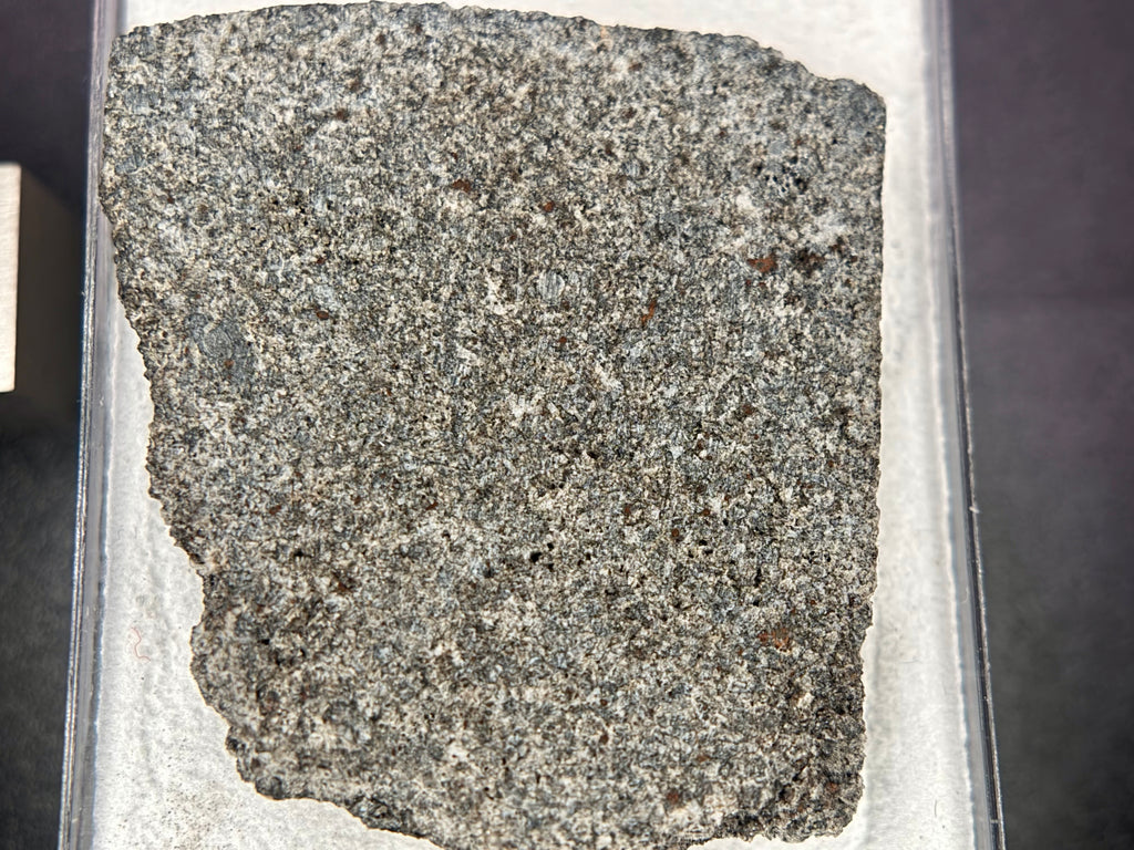 Ksar Ghilane 022 achondrite end cut 9.07g -- equant augite grain boundaries visible in polished interior