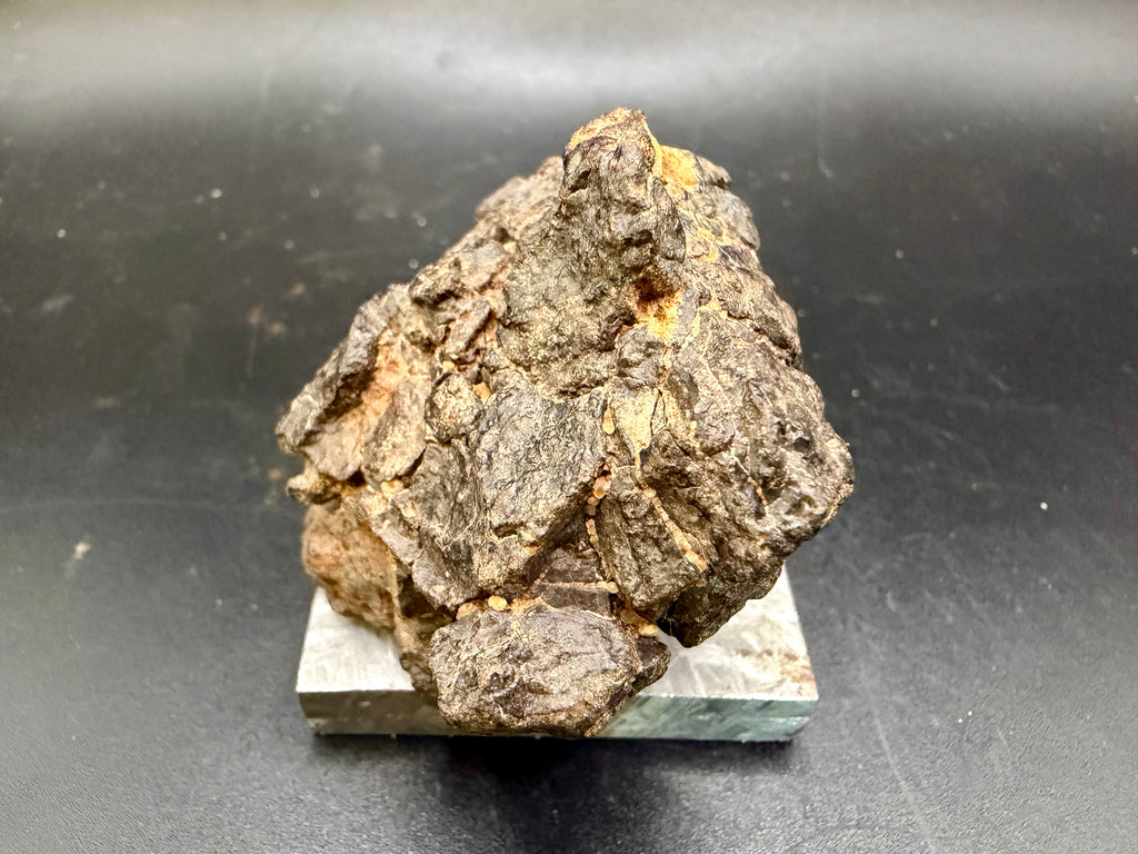 Rear view of NWA 18592 Mesosiderite Meteorite showing complete individual form and natural brecciated stony-iron exterior, 161g