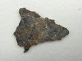Adrar 013 lunar melt breccia slice, 3.00 g, polished face with gray and tan clasts, white veining and orange-brown staining along the upper edge, on white background