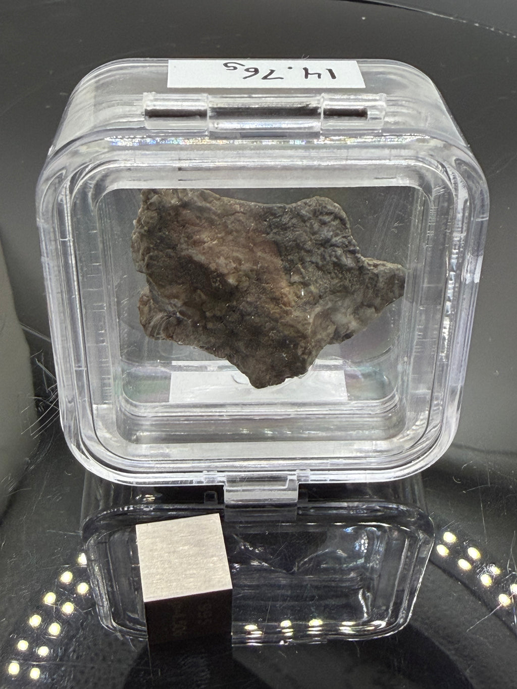 Adrar 013 lunar meteorite 14.76g complete individual in labeled display case with metal cube for scale, preserved lunar crustal composition