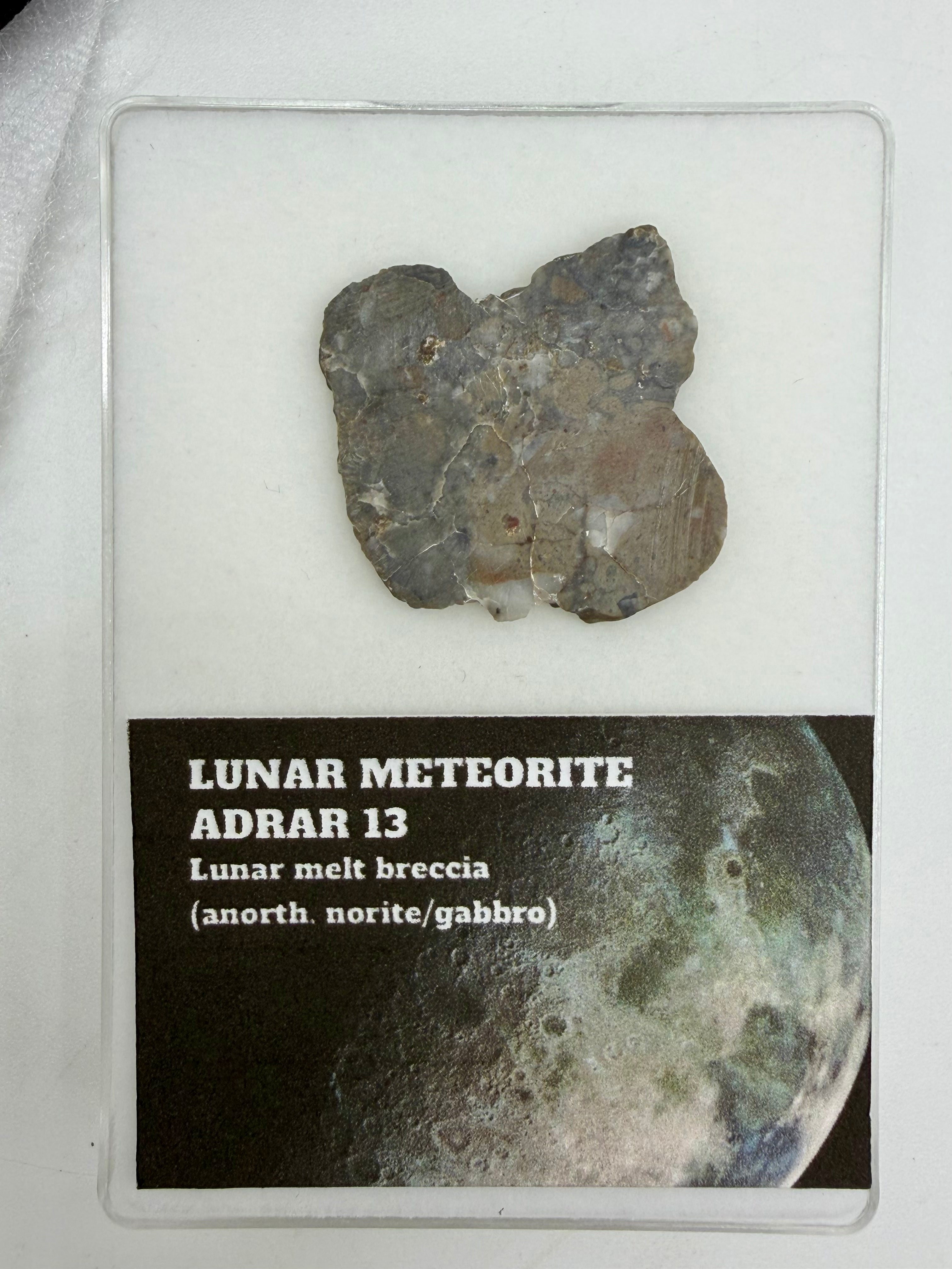 Adrar 013 lunar meteorite end cut, 4.29g, with display card showing classification