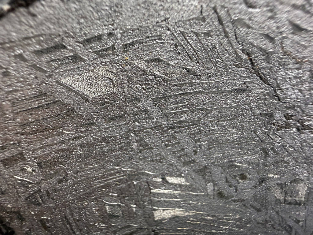 Close-up of the etched metal surface on the Aletai iron meteorite slice
