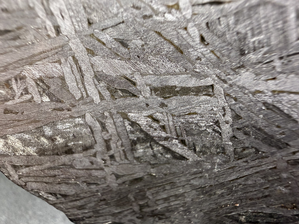 Macro view of Widmanstatten pattern on 334.12g slice of Aletai meteorite 