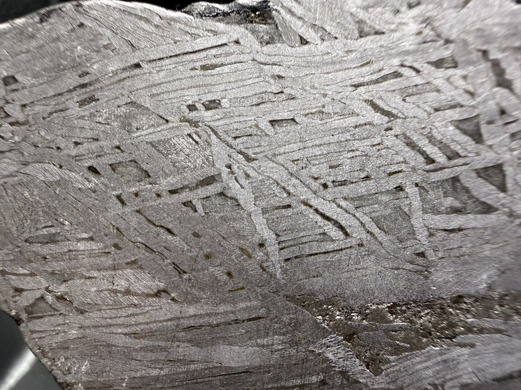 Close view of the Widmanstatten pattern in the Aletai IIIE-an iron meteorite, interlocking metal bands