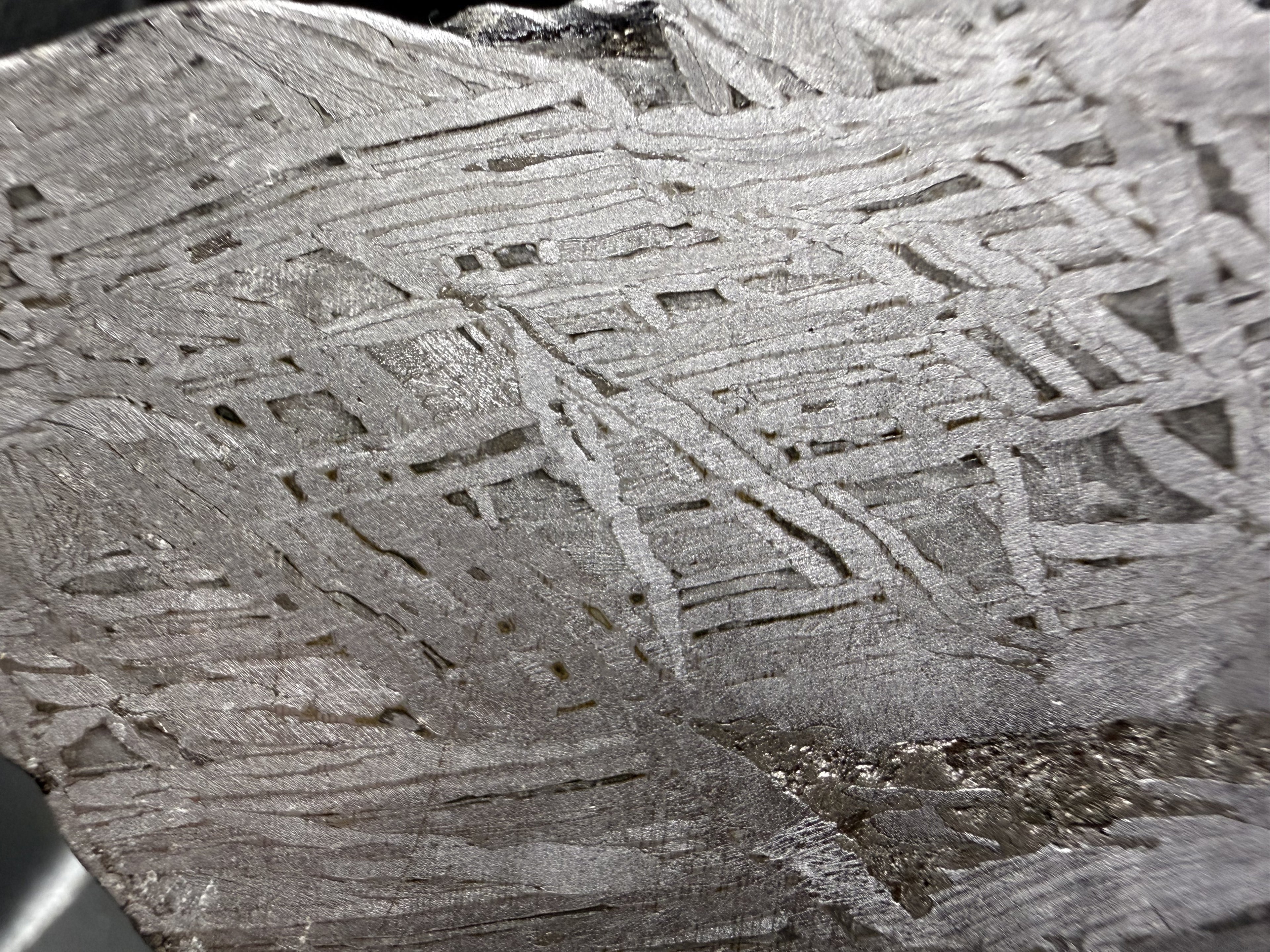 Close view of the Widmanstatten pattern in the Aletai IIIE-an iron meteorite, interlocking metal bands