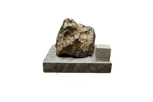 Amgala 001 Martian shergottite, 40.80g complete individual, front view displayed on Muonionalusta iron meteorite plate with titanium element cube for scale