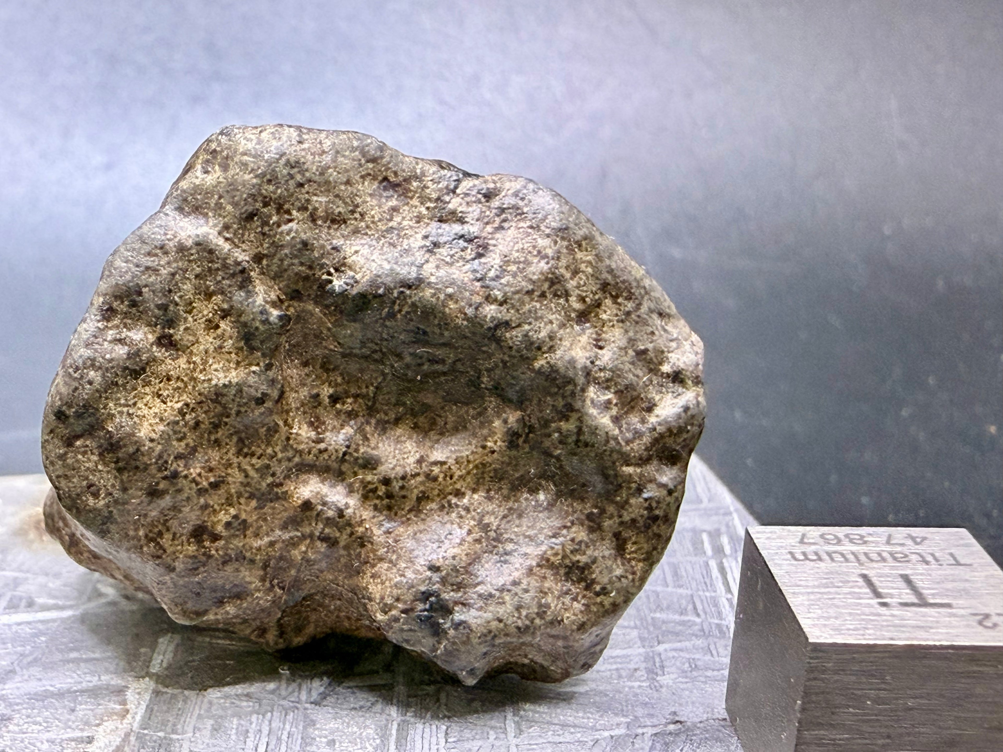 Amgala 001 Martian shergottite, surface detail showing shock vein and regmaglypt structure on 40.80g complete individual