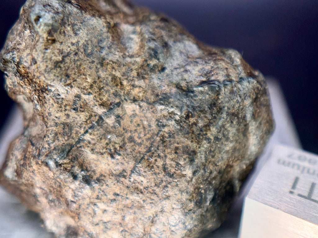 Amgala 001 Martian shergottite, top-down view of 40.80g complete individual showing regmaglypt depressions across upper surface