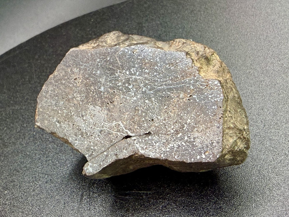 Weathered brown exterior of the Bir Ounane 001 end cut seen in profile