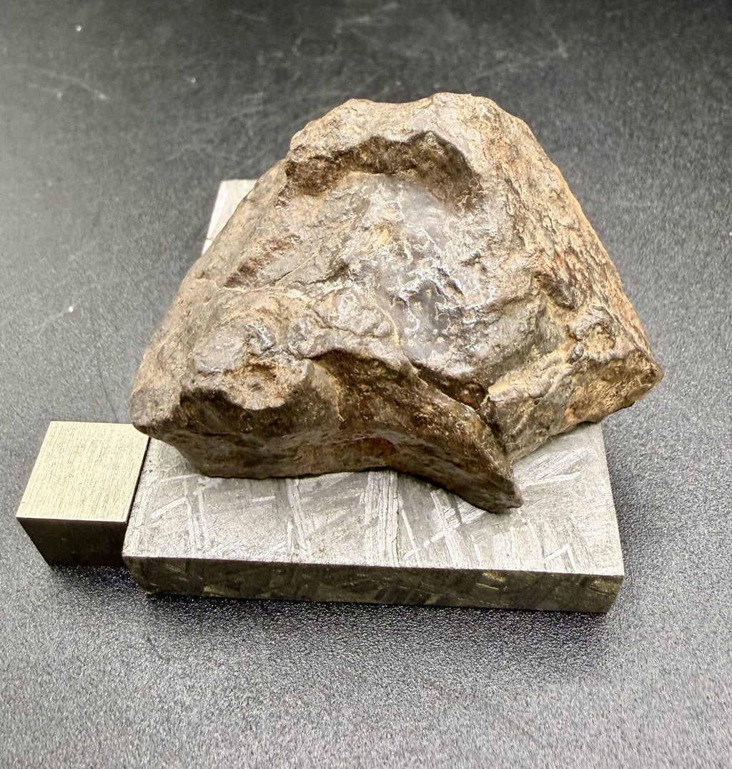 Bir Ounane 001 primitive achondrite end cut, 70.22 g, seen from the exterior side