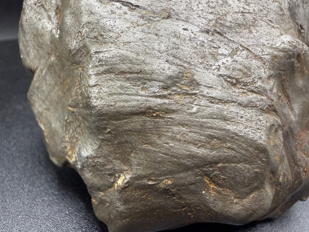 Close-up of sweeping shear lines on Gebel Kamil iron meteorite