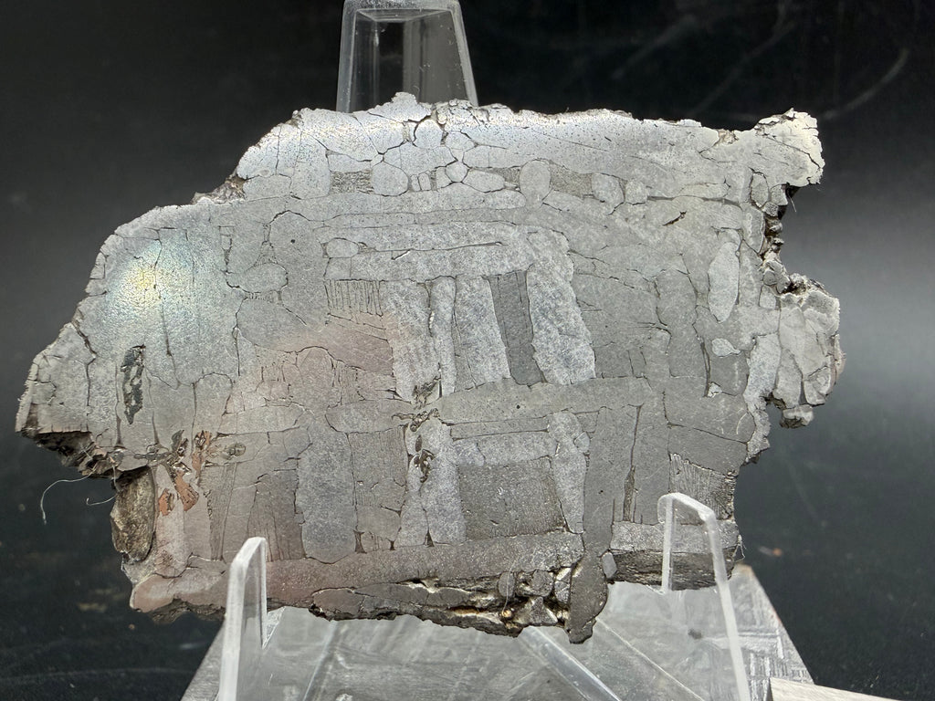 Kaalijärv iron meteorite 29.51g full slice on acrylic display stand top-down view showing weathered edge