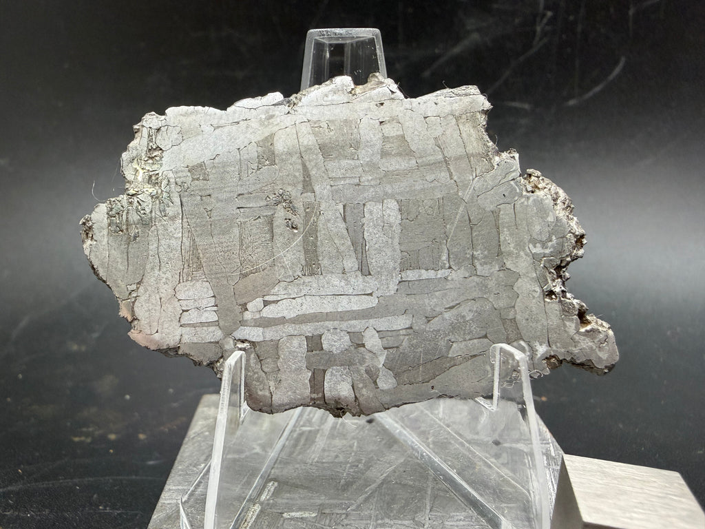 Kaalijärv iron meteorite 29.51g full slice on acrylic display stand angled view showing slice thickness and weathered natural edges