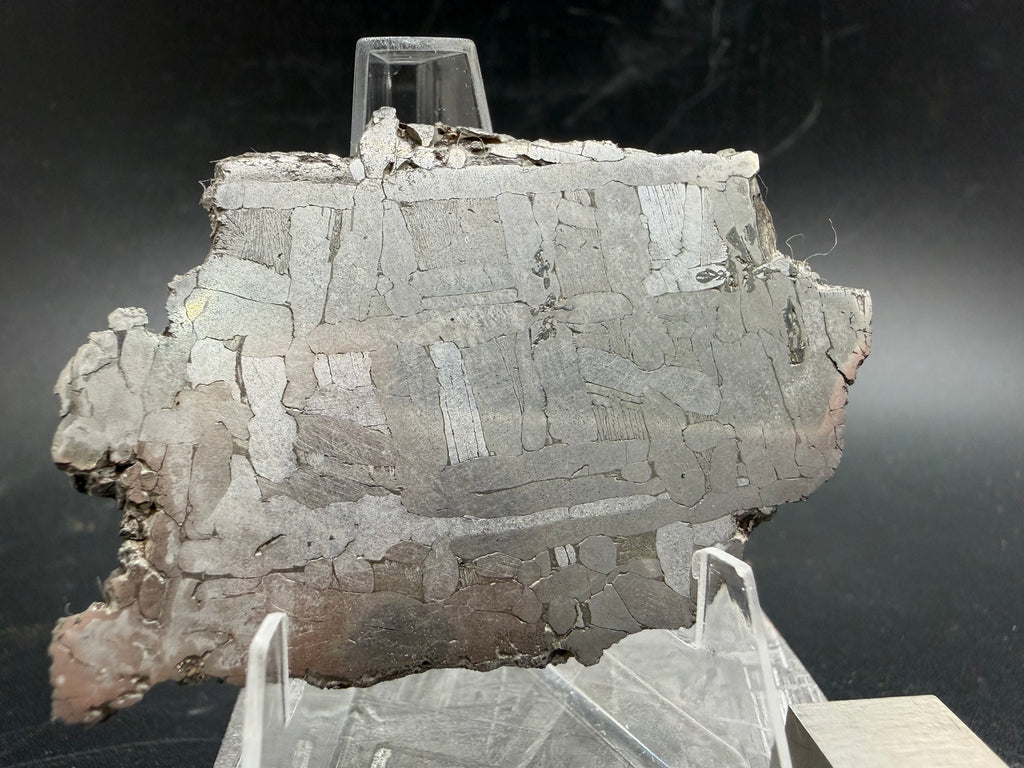 Kaalijärv iron meteorite 29.51g full slice on acrylic display stand three-quarter view showing etched face and weathered crust