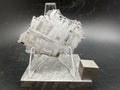 Kaalijärv iron meteorite 31.18g full slice on acrylic display stand front view showing broad kamacite banding and Widmanstätten pattern with titanium cube for scale