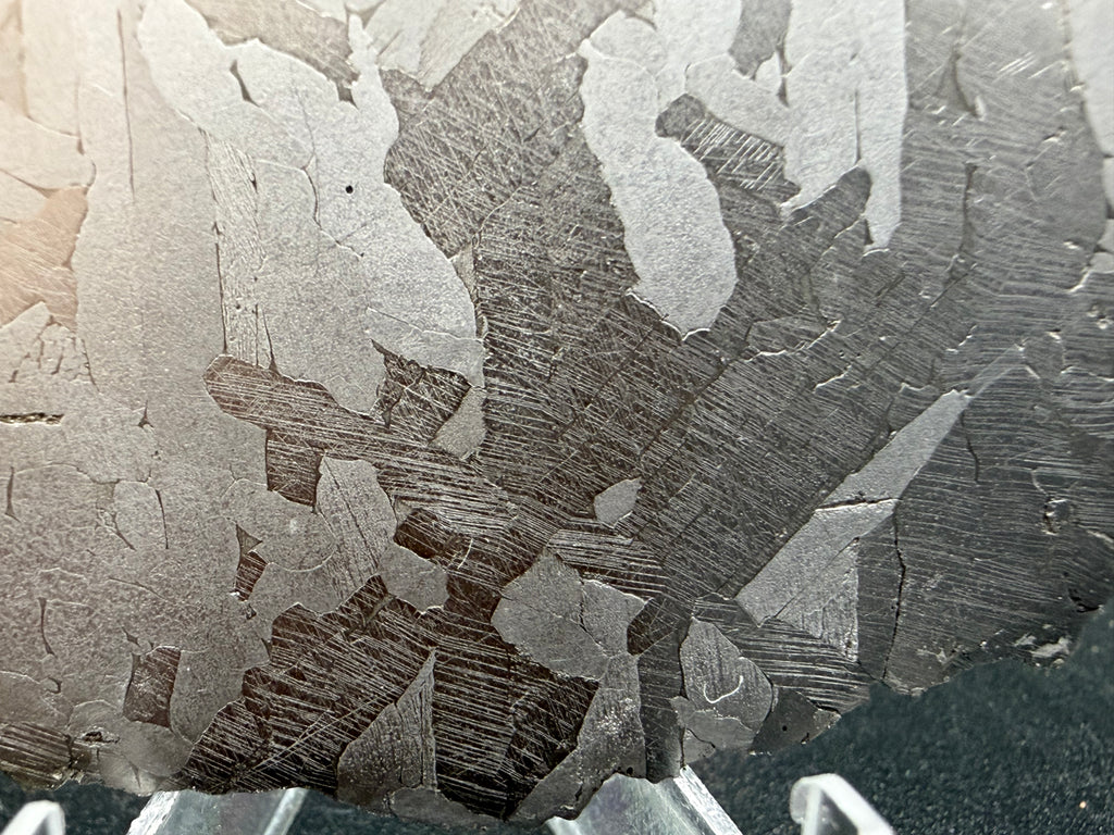 Kaalijärv iron meteorite 45.71g full slice macro detail of Neumann bands within kamacite lamellae on lower portion