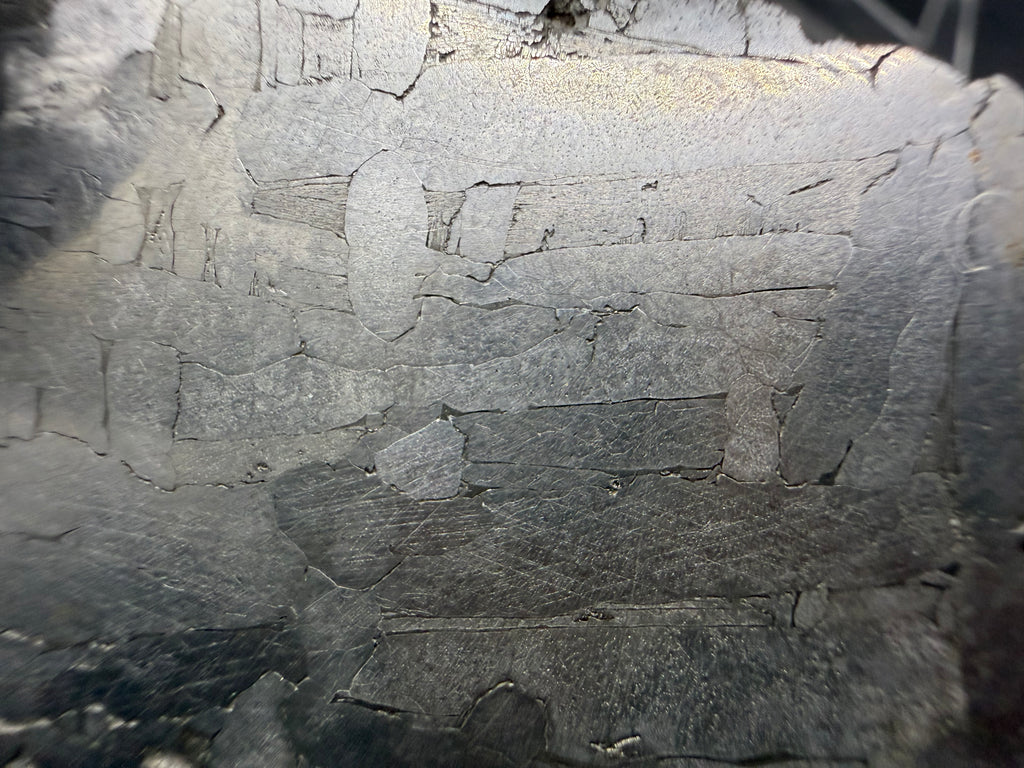 Kaalijarv iron meteorite, IAB-MG, 21.42 g slice, close-up of the etched face showing elongated metal plates and grain boundaries of the Widmanstatten pattern