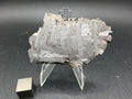 Kaalijarv iron meteorite, IAB-MG, 30.35 g slice on a clear acrylic stand with a scale cube, full view of the etched face showing crossing Widmanstatten plates