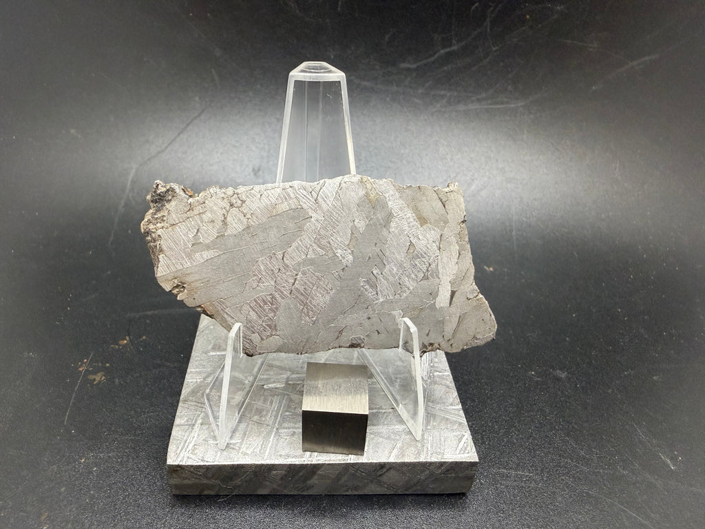 Kaali järv iron meteorite slice on display stand, front view